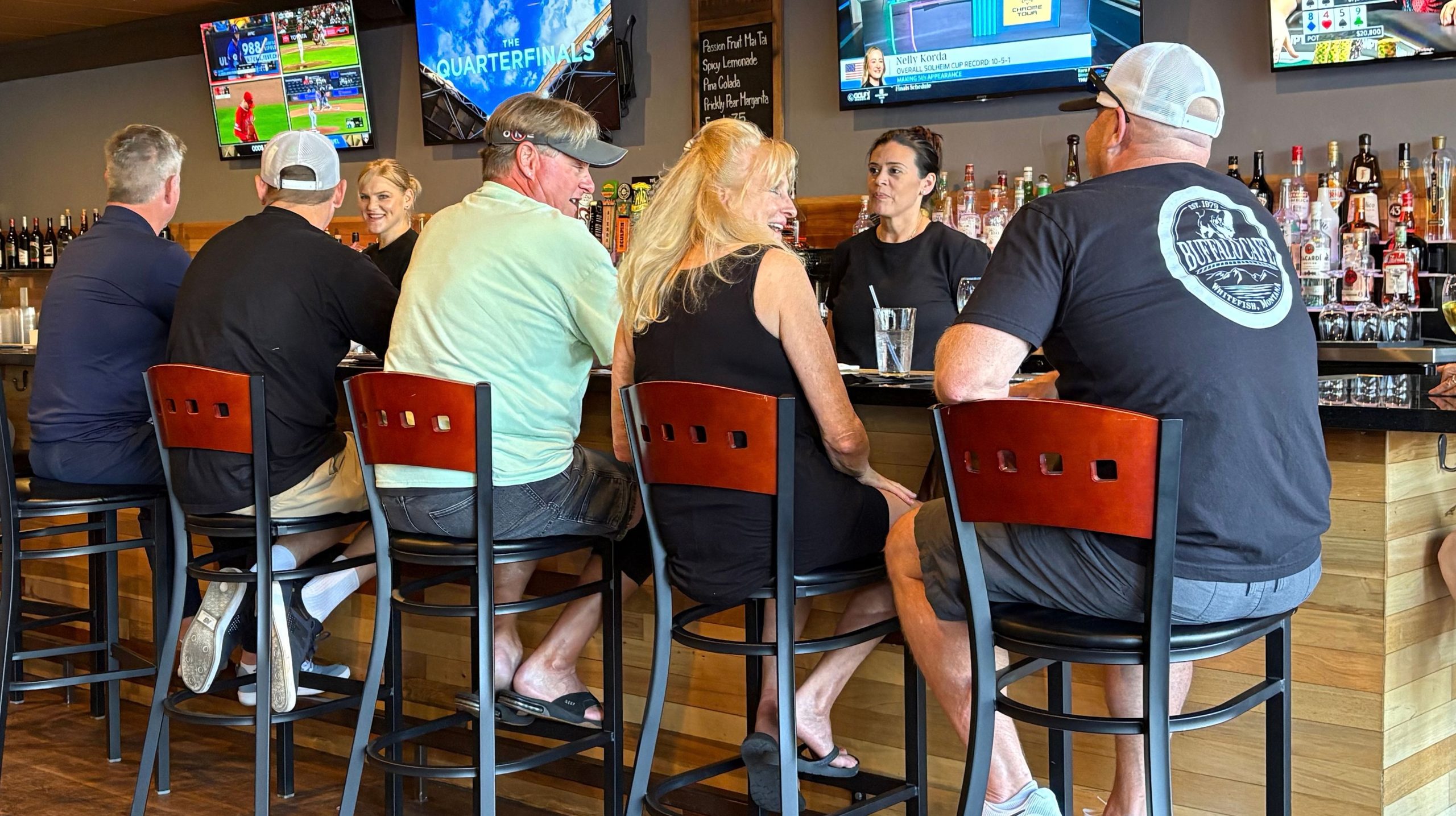 Friends gathered at the DeVino's bar