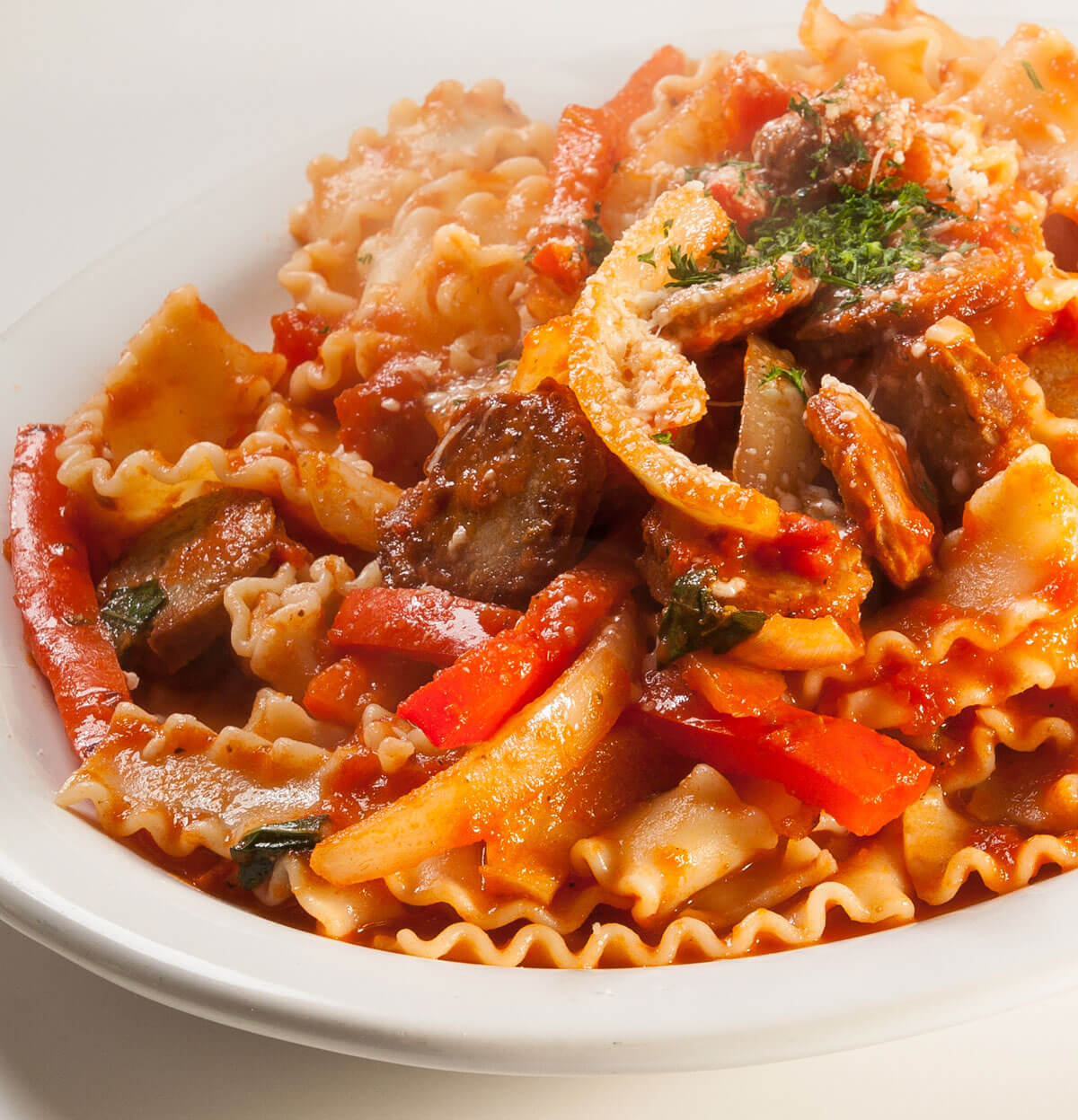 Fedelini with Italian sausage and bell peppers in tomato sauce